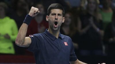 Novak Djokovic celebrates after winning his match against Dominic Thiem during their round robin stage men's singles match at the ATP World Tour Finals in London. Tim Ireland / AP Photo