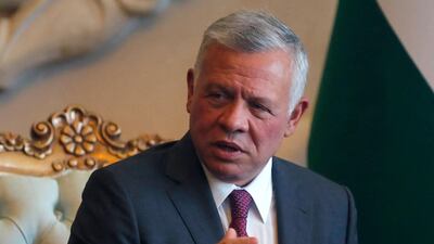 Jordanian King Abdullah II looks on as he's received by Iraq's President at Baghdad Airport. AFP