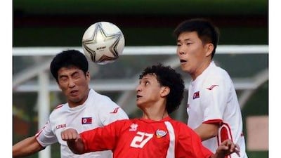 Omar Abdulrahman goes up against two North Korean players in the men’s quarter-final match at the Asian Games on Friday.