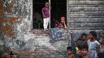 Rohingya Muslims displaced by violence pass the time at a former rubber factory serving as their shelter near Sittwe. Damir Sagolj / Reuters