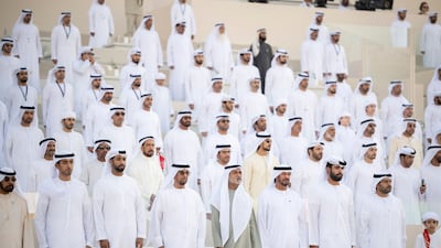 Sheikh Zayed bin Saif; Sheikh Nahyan bin Mubarak, Minister of State for Tolerance; and Sheikh Mohamed bin Nahyan stand for the national anthem with other dignitaries. Abdullah Al Junaibi for the Presidential Court
