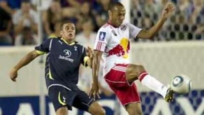 Red Bull's Thierry Henry, right, is shadowed by Kyle Walker, the Tottenham defender, during Thursday night's pre-season match. Henry scored his first goal for his new club but could not stop them losing 2-1.
