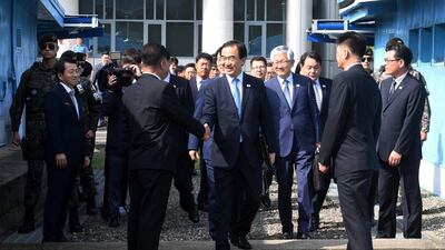South Korean Unification Minister Cho Myoung-gyon crosses into the North Korean side of Panmunjom for talks on August 13, 2018. Yonhap via AP