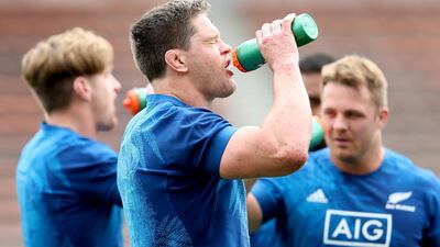 Scott Barrett gets some much-needed fluids down during All Blacks' training in Japan. Getty
