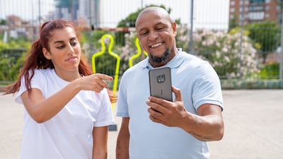 Football freestyler Lisa Zimouche and Brazil football great Roberto Carlos star in a new marketing campaign for Nokia