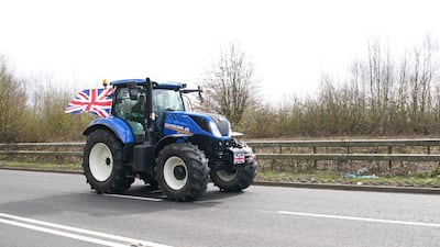 A tractor heads for London on the A20 in Kent. PA