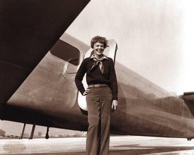 A May 20, 1937 photo shows US aviator Amelia Earhart next to her Lockheed 10 Electra. Albert Bresnik / The Paragon Agency / AFP