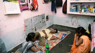 Mohammad Awwal, 19, who has dengue fever, rests at home in New Delhi. Manan Vatsyayana / AFP