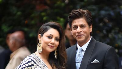 Bollywood actor Shahrukh Khan (R) and his wife Gauri Khan arrive for the pre-engagement party (they were also at the Saturday night party). AFP