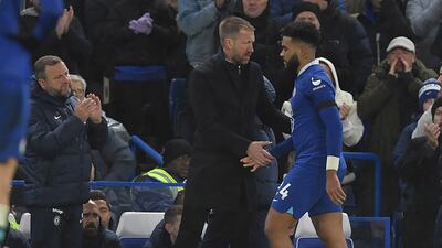 Reece James is comforted by manager Graham Potter after he was injured. EPA
