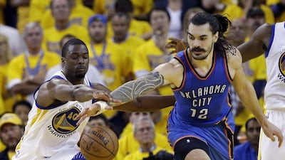 Oklahoma City Thunder's Steven Adams, right, fights for a loose ball against Golden State Warriors' Harrison Barnes during the second half in Game 1 of the NBA basketball Western Conference finals Monday, May 16, 2016, in Oakland, Calif. Oklahoma City won 108-102. (AP Photo/Marcio Jose Sanchez)