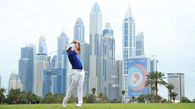 Ian Poulter of England plays his second shot on the 13th hole. Getty Images