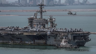 The U. S. Navy Nimitz-class aircraft carrier USS Abraham Lincoln sails toward Laem Chabang Port before docking for a rest stop following a long deployment in the Middle East, with the Pattaya skyline in backdrop, in Chonburi province, Thailand, September 2, 2026. REUTERS / Chalinee Thirasupa