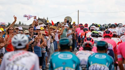 Spectators cheer on the peloton during Stage 6.