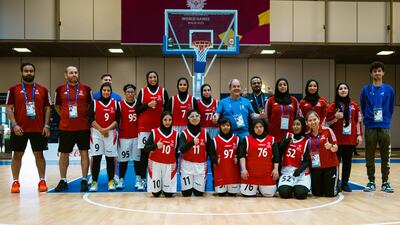 A team photo of the UAE women's basketball and coaching staff in Berlin