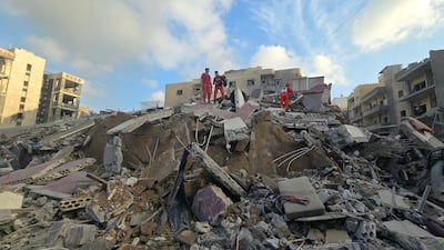 First responders at the site of an Israeli strike near Jabal Amel Hospital in Tyre, southern Lebanon. AFP