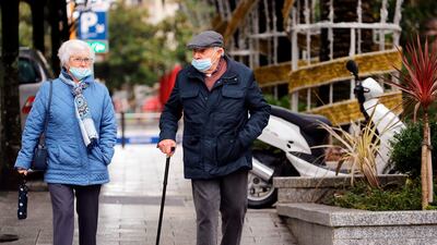 A stroll, with face masks, in Biarritz, south-western France. French Health Minister Olivier Veran said France had no confirmed cases of the Omicron variant and was not changing its strategy of increasing vaccinations and booster shots. AP