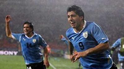 Uruguay's Luis Suarez, right, celebrates after scoring the second goal during the World Cup match against South Korea at Nelson Mandela Bay Stadium in Port Elizabeth.