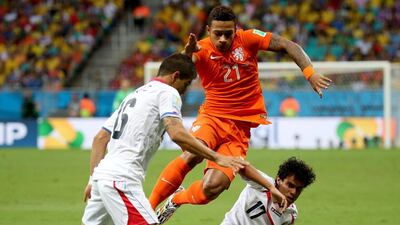 Memphis Depay of the Netherlands in action during his side's eventual shootout victory over Costa Rica in the 2014 World Cup quarter-finals on Saturday. Ali Haider / EPA