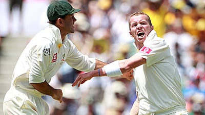 Ricky Ponting, Australia's captain, tries to restrain Peter Siddle after the dismissal of England's Matt Prior in Perth.