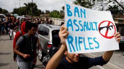 Students from South Plantation High School carrying placards and shouting slogans walk on the street during a protest in support of gun control, following a mass shooting at Marjory Stoneman Douglas High School, in Plantation, Florida, February 21, 2018. Carlos Garcia Rawlins / Reuters