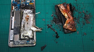 A Samsung Note 7 handset next to its charred battery after tests. Edgar Su / Reuters