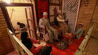 Wax figures depict a scene of life in Baghdad in the past.