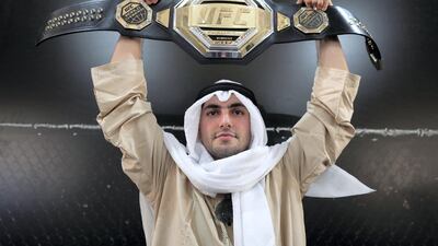 Yousif Ismamailov holds up the belt. Chris Whiteoak / The National