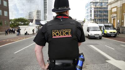 A police officer patrols the street in the London Bridge area of London. Politicians have already promised a tough response after last week's terror attack. (AP Photo/Alastair Grant)