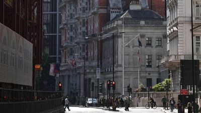 Smoke rises from a building in Knightsbridge, central London, as London Fire Brigade responded to a call of a fire in this exclusive location. John Stillwell/ PA via AP