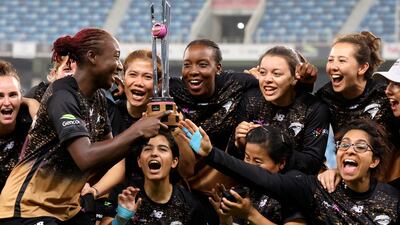 Tornadoes' players pose with the trophy after their win in the FairBreak Invitational final against Falcons at the Dubai International Stadium on Sunday. AFP