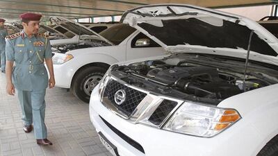 Ajman police chief inspects cars at the Hamidiya police station.