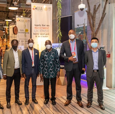 Abeine Abdul Adam, chief executive of Imagine Pharmaceuticals (from left); Morrison Rwakakamba, UIA chairman; Matia Kasaija, Uganda’s Minister of Finance, Planning and Economic Development; Robert Mukiza, UIA’s director general; and Leon Lin, Worldera’s general manager; at the Uganda pavillion . Courtesy: UIA