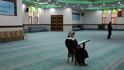 An elderly Palestinian man prays at a mosque during the usually crowded weekly Friday prayers, in the midst of the coronavirus COVID-19 outbreak, in the West Bank town of Hebron. AFP