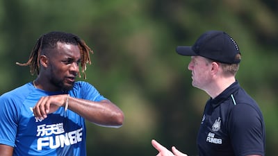 Newcastle manager Eddie Howe talks with Allan Saint-Maximin.