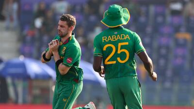 South Africa's Anrich Nortje, left, takes a catch to dismiss Bangladesh's Mahedi Hasan. AP