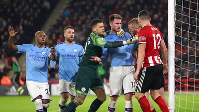 Aymeric Laporte with Oliver McBurnie of Sheffield United on his return from injury. Getty