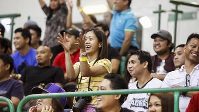 A fan cheers during the PBA game between GlobalPort Batang Pier and Rain or Shine Elasto Painters on Thursday in Dubai. Antonie Robertson / The National