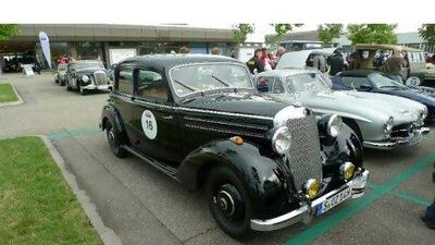 The Mercedes 170 DS sits beside the company's more famous 1955 300 SL gullwing sports car. Neil Vorano for The National