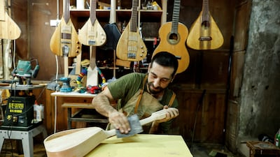 Palestinian musician Tamer Omari's new instrument is designed to seamlessly mesh eastern melodies with western beats. The 38-year-old Palestinian's new instrument is called a udulele, which allows musicians to play Arabic maqam, using distinctive microtonal frets while capturing the simplicity of guitar strings. All photos: Reuters