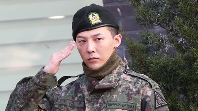 G-Dragon, a member of South Korean boy band BIGBANG, salutes after being discharged from military service at a military base in Yongin, South Korea, 26 October 2019. EPA