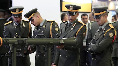 Visitors look at displayed exhibits during the EDEX Egypt Defence Exhibition 2018, in Cairo. EPA