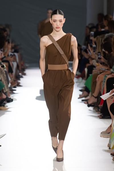 Max Mara has crafted a one-shoulder number in bitter chocolate. Courtesy Max Mara