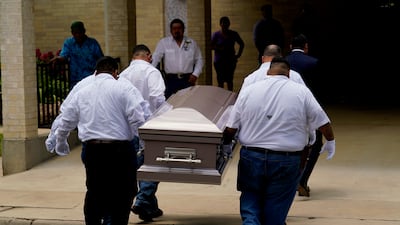 Pallbearers carry the coffin of Amerie Jo Garza into Sacred Heart Catholic Church. AP
