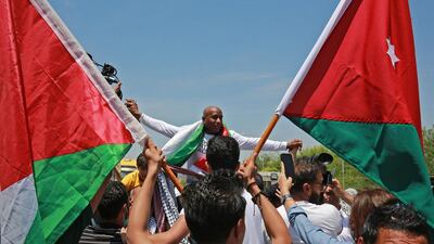 Palestinian-Jordanian Abdullah Abu Jaber, who was jailed in Israel after planting a bomb on a bus that wounded 13 civilians in 2000, is welcomed upon his release at the Sheikh Hussein Crossing between Jordan and Israel. AFP