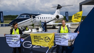 Environmental activists engage in a climate protest at the European Business Aviation Convention and Exhibition at Geneva Airport in Switzerland. EPA