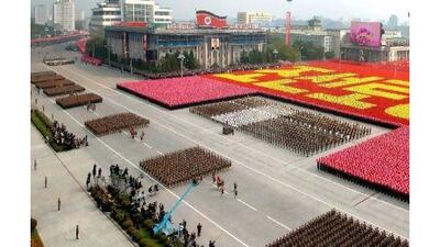 North Korean security personnel march in celebration of the country's 65th anniversary of the foundation of the Workers' Party of Korea. A reader notes that the reclusive North continues to fascinate. AFP via KCNA