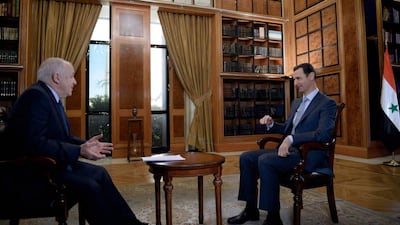 Syrian President Bashar Al Assad talks to the BBC’s Middle East editor, Jeremy Bowen, in Damascus. SANA / AFP Photo
