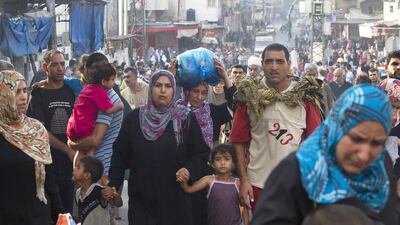 Witnesses said the shelling of Shujaieh left bodies strewn in the streets and thousands fleeing for shelter.