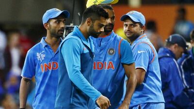 Virat Kohli, centre, failed to live up to his world-class ability in the World Cup semi-final against Australia. David Gray/ Reuters